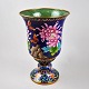 Cloisonne floor 
vase. 20th 
century China. 
Decorations 
with flowers 
and 
butterflies. H: 
32 cm.
 