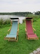 Deck chairs from the 1930's
With foot"stool" and sun"shade"
In stock: 1 green
A professional upholsterer has provided these 
chairs with the new and strong fabric and the wood 
as well as the metal is in a very good condition.