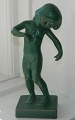 Figure in 
ceramic of 
Venus Kalipygos 
from Peter 
Ipsen's Enke. 
Covered in 
green glaze. 
Made by ...