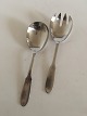 Georg Jensen 
Stainless Matte 
"Mitra" Serving 
Set. Measures 
21 cm L (8 
17/64").