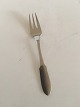 Georg Jensen 
Stainless Matte 
"Mitra" Fish 
Fork. Measures 
16.6 cm / 6 
17/32 in.