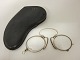 A pair of glasses incl. case
An old pair of glasses to place at the nose incl. case on which is written: A. 
M. Berg, Odense