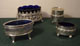 Silver plated 
salt cellars 
with blue glass