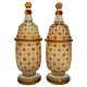 A pair of glass 
vases with lid. 

H. 28 cm. 
Bohemia, around 
1930.