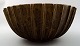 Arne Bang. Very large bowl of stoneware with fluted body with brown-green glaze.