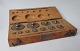 Box with brass 
weight, 20th 
century. 
Struers. 
Denmark.
With 11 
weights and 
tweezer. 20 x 8 
cm.