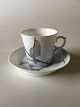 Royal 
Copenhagen Art 
Nouveau Mocha 
Cup and Saucer. 
The cup has a 
small chip and 
a hairline ...