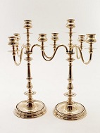 Three-arm brass candlesticks sold