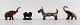 Four miniature 
figures in 
various metals, 
early 1900s.
Two elephants, 
scottie and ...