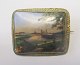 Porcelain brooch with hand painted city scene, 19th century. Germany. City with towers, castle, ...