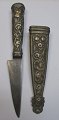 Antique 
Argentine 
dagger, 19th 
century sheath 
and gilded 
metal handle. 
Decorated with 
flowers. ...