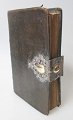 The Pontopidian 
Psalm Book, 
Schleswig 1798. 
With leather 
binding and 
silver bracket 
with ...