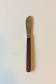 Almue Cohr 
Brass and Wood, 
Dinner Knife. 
Measures 21 cm 
/ 8 1/4"