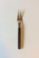 Almue Cohr 
Brass and Wood, 
Meat Fork. 
Measures 23.3 
cm / 9 1/4"