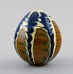 Kähler, Denmark, glazed stoneware, egg with hole in the bottom and top. 1940s.