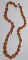 Danish amber 
chain of 
polished 
pieces, approx. 
1900. Length: 
54 cm.
Nice work!
