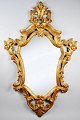 Italian carved 
gildwood rococo 
wall mirror, 
19th century H: 
98 cm. B: 64 
cm.
Provenance: 
Artist ...