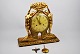 Swedish Mantel 
clock, art 
deco, 1920 - 
1930. Gold 
plated wood. 
Decoration in 
the form of two 
...