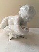 Bing and 
Grondahl, Child 
on dolphin # 34 
# 4034, 9cm 
tall, 1st 
grade, Design 
Kai Nielsen * 
...