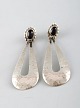 Danish design, a pair of sterling silver earrings.
