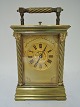 French Carriage clock with ½ hour repetion. Height 15 cm. Clockwork is alright.