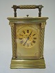 French Carriage 
clock with ½ 
hour repetion. 
Height 15 cm. 
Clockwork is 
alright.