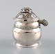 Mustard pot by Evald Nielsen, Denmark in hammered silver with organic 
ornamentation.