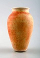 Vivi Calissendorff (born 1930), Swedish ceramist.
Small unique ceramic vase in yellowish brown tones.