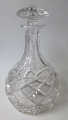 Crystal carafe 
with spill box 
and stopper, 
20th C. Height: 
26.5 cm. 
Melody: Helan 
goes.