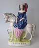 Staffordshire 
figure 
"Duchess", 
painted 
faience, 
approx. 1840, 
England. 22.5 x 
16.5 cm.
Flawless!
