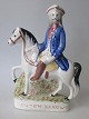 Staffordshire 
Figure of the 
robber "Tom 
King", painted 
faience, 
approx. 1840, 
England. 25 x 
17.5 ...