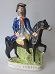 Staffordshire 
figure, robber 
"Dick Turpin", 
painted 
fajance, 
approx. 1840, 
England. 29 x 
21 ...