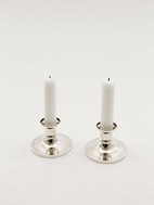 A pair of 830 silver candles sold