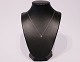 Necklace in 10 
ct. white gold, 
stamped AU, 
with pendant in 
925 sterling 
ilver with  ...
