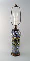 Aluminia faience table lamp, hand painted with floral motifs.
