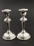 A pair of English sterling silver candlesticks sold