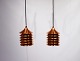 A pair of Duett 
copper pendants 
designed by 
Bent Boysen in 
the 1970s. The 
pendants are in 
great ...