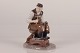 Bing & Grøndahl 

Figure no. 
2228 of a 
shoemaker by 
Axel Locher
With stamp 
from the period 
...
