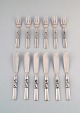 Georg Jensen. Cutlery, Scroll No. 22, Complete Fish Service of Hammered Sterling 
Silver.