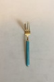 Gilded Sterling 
Silver with 
blue Enamel 
Cake Fork. 
Measures 14 cm 
/ 5 33/64 in.