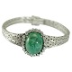 18 kt. White 
gold bracelet 
with 1 large 
cabochon sanded 
emerald 
(approx. 
20.00ct,) and 
with 22 ...