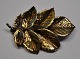 Brooch, gilded 
sterling 
silver, "Flora 
Danica", 
Askhim, 20th 
century 
Copenhagen, 
Denmark. ...