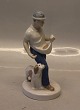 21912 "The 
Sower" 19.5 cm 
German 
Porcelain 
Figurine 
Crossed Swords