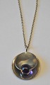Finnish 
necklace in 
sterling silver 
with violet 
stone. 20th 
century. Dia .: 
3 cm. Stamped. 
With ...