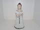 Lyngbybird  
figurine, girl 
in white and 
green dress 
holding book.
Decoration 
number ...