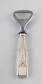 Hans Hansen 
silverware 
number 2. 
Bottle opener 
in danish 
silver and 
stainless 
steel. 
Measures: ...