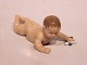 Royal 
Copenhagen 
porcelain 
figure, laying 
baby, no.: 
1739.
6.5x15x8 cm.
