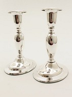 A pair of 830 silver candlesticks sold