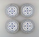 A set of 4 antique Royal Copenhagen Blue Fluted full lace plates with gold rim.