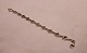 Divided 
bracelet of 
silver.
20 cm.